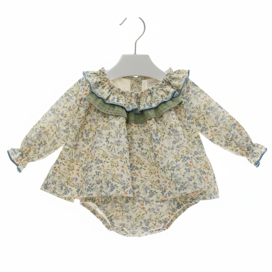 Floral baby dress on plain white hanger